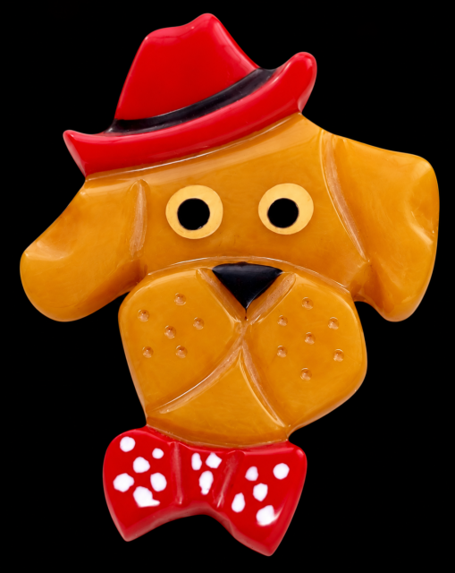 Shultz Bakelite dog pin with hat/bowtie